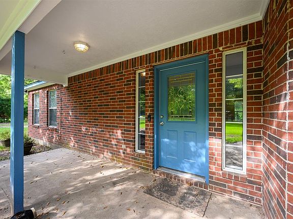 Large covered patio with fresh paint outside.