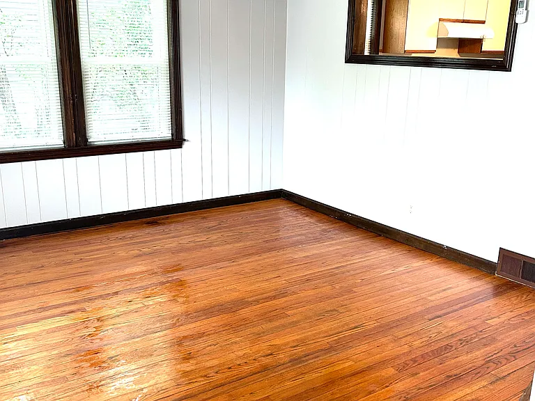 Livingroom with mini split and beautiful hardwood floor.