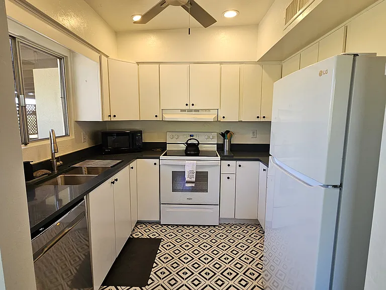 Fully equipped kitchen. Full size fridge, electric range, dishwasher, microwave, toaster, duo coffee maker (k cup and 12-cup combo), French Press and tons of kitchen gadgets. Service for 8 of dishes and flatware. Serving pieces, cookware and bakeware.