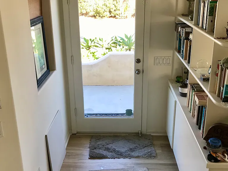 The front door is glass, and brings in lots of light!