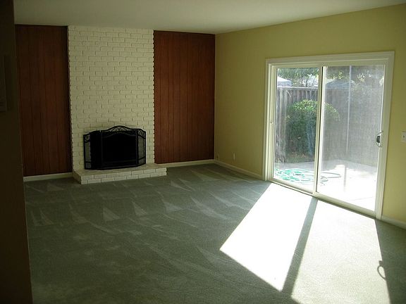New carpet, refinished hardwood floors and paint throughout.