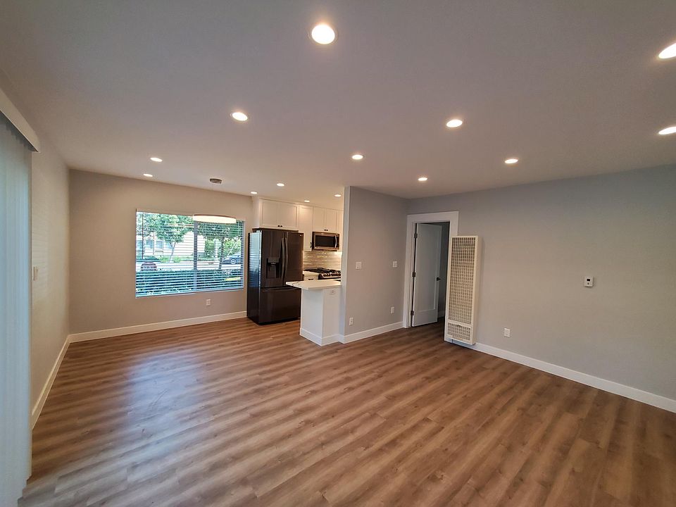 Another view of large living/dining room with custom dimmable lighting