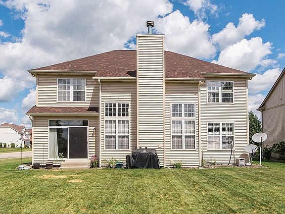 Back view with large yard