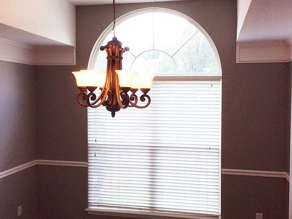 Gracious formal dining rm w/palladium window, unique molding