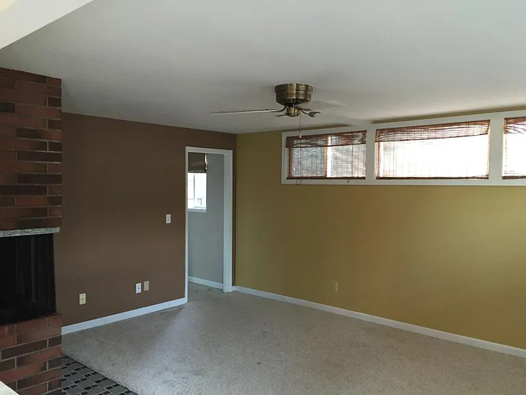 roomy family room with lots of natural light and gas firepla