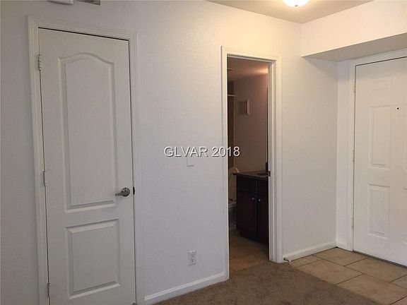 Main door entrance showing entry to second bath and coat closet