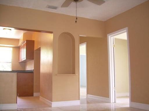 Dining room with kitchen on left and two rooms on right