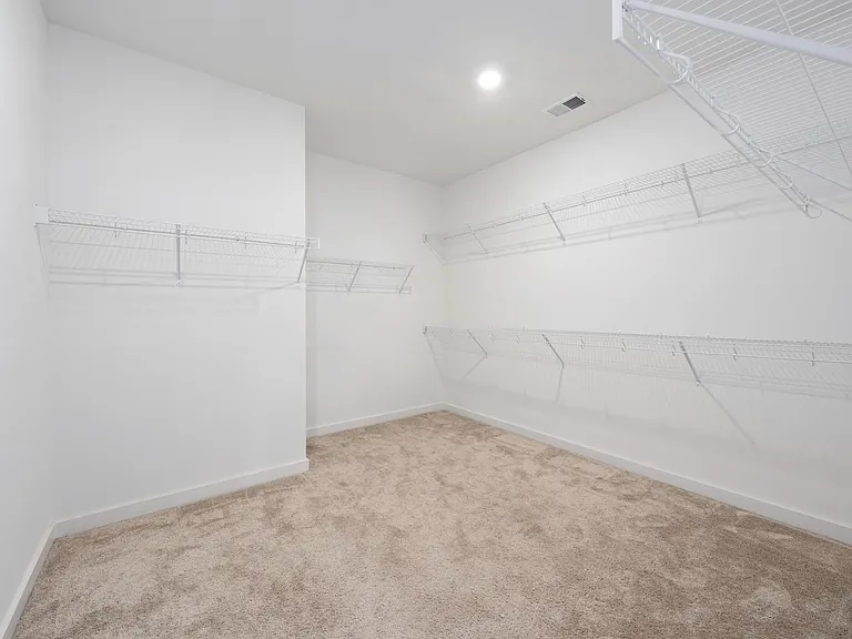 primary closet has been updated with wood flooring (no carpet)