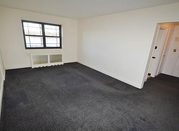 Large living room with covered hardwood floors and Picturesque views of Lake Isle.