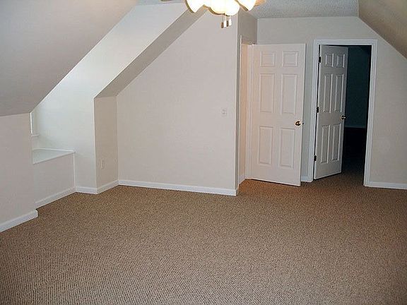 upstairs game room or family room with extra storage