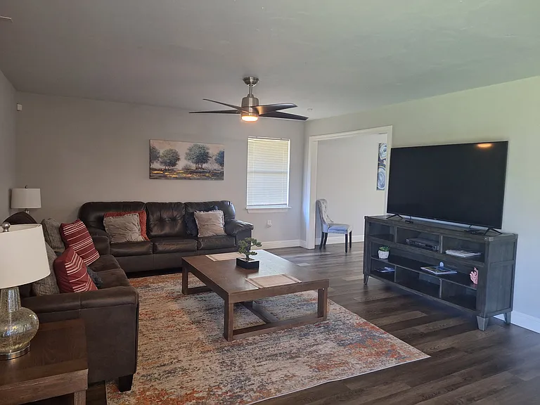 Living room with couch and sofa sleeper.