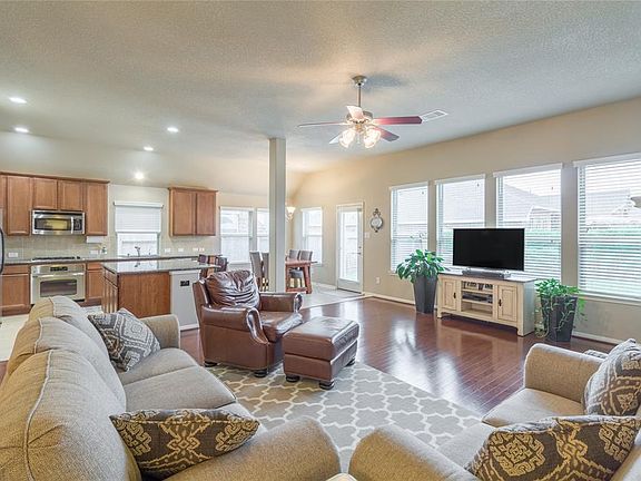 Another view of living, kitchen, breakfast areas.