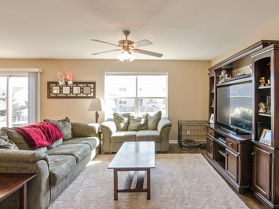 Spacious & bright family room with trendy wood laminate flooring