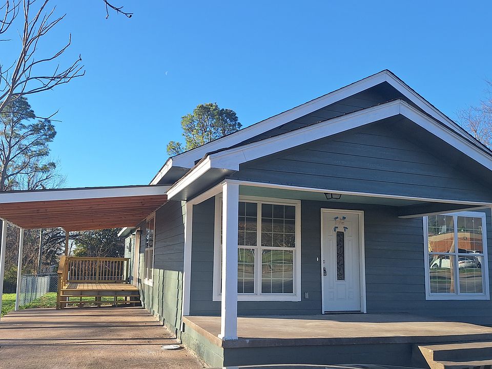 Front porch, carport and deck off of kitchen