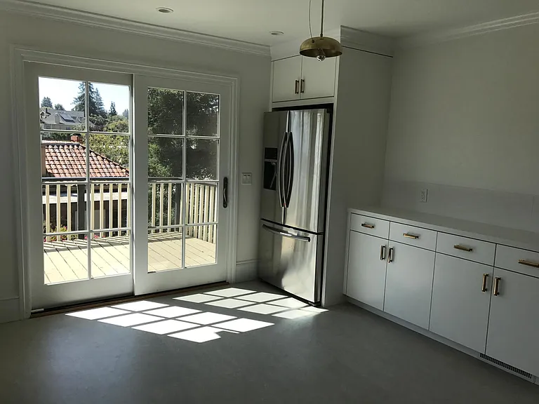 Kitchen and deck beyond.