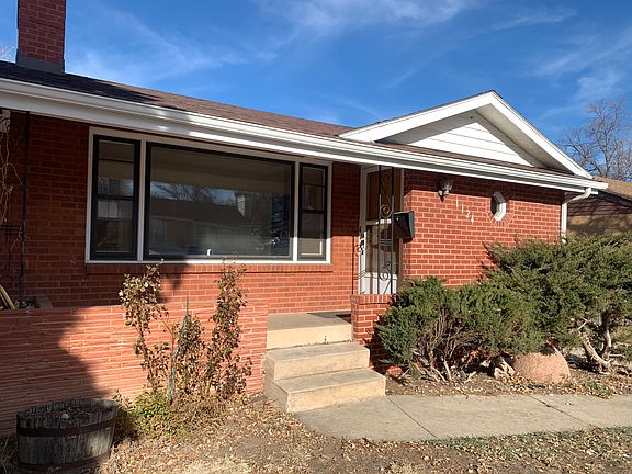 Cute sunny front porch. View of picture window, rose bush and front entrance. Welcome home!