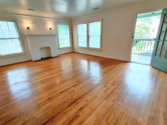 Living room with front balcony door open