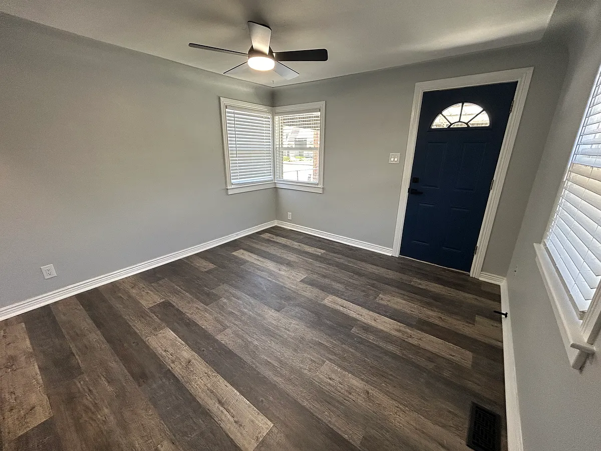 Living room, new windows, flooring, and paint. - 935 Walnut St
