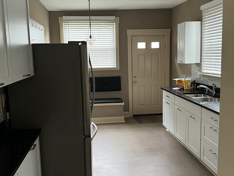 Cork floored eat in kitchen with new appliances