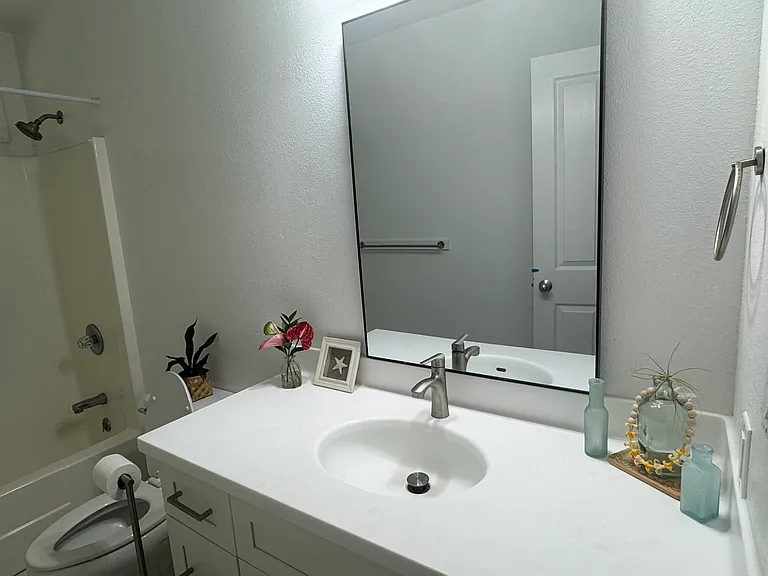 Newly renovated bathroom vanity, countertop, & hardware.