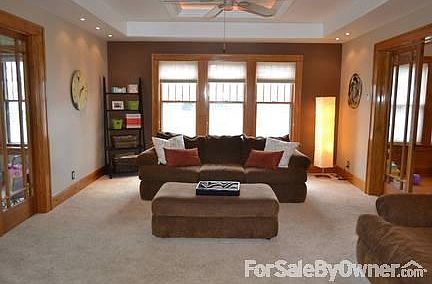 Living room
						:
						Lots of light with movie theater lighting, tray ceiling, and french doors