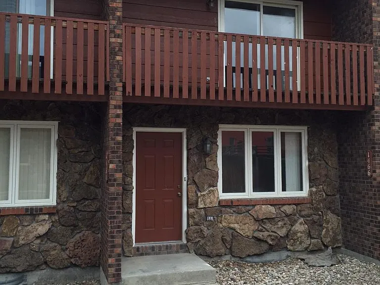 Front door with master deck above