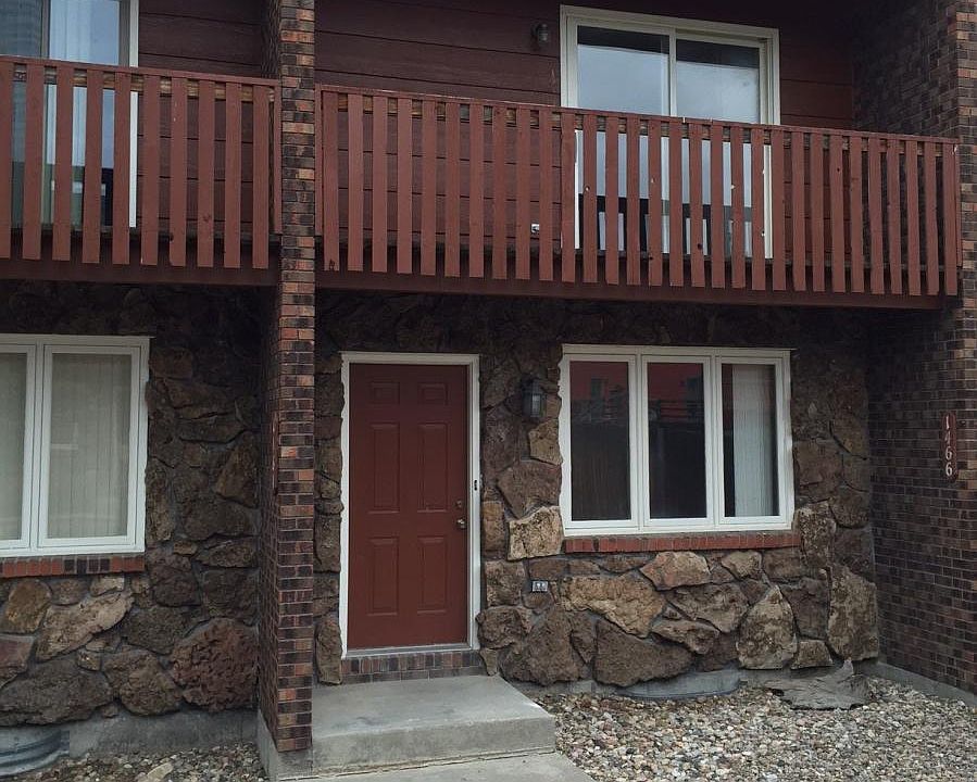 Front door with master deck above