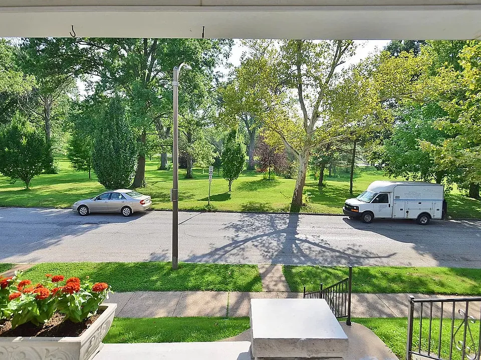 Spacious front porch w/ park views