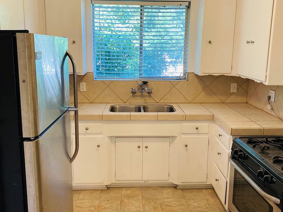Kitchen with sliding door to dining area.