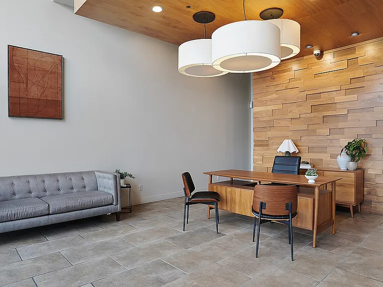 A welcoming leasing office and lobby space designed with modern finishes and comfortable seating.