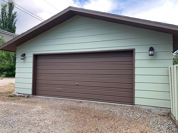 Detached garage. Access is through the alley. Dark sensing lights on each side.