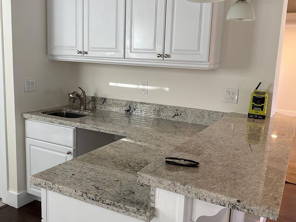 Wet bar and room for bar stools. All new granite and cabinets