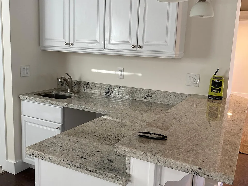 Wet bar and room for bar stools. All new granite and cabinets