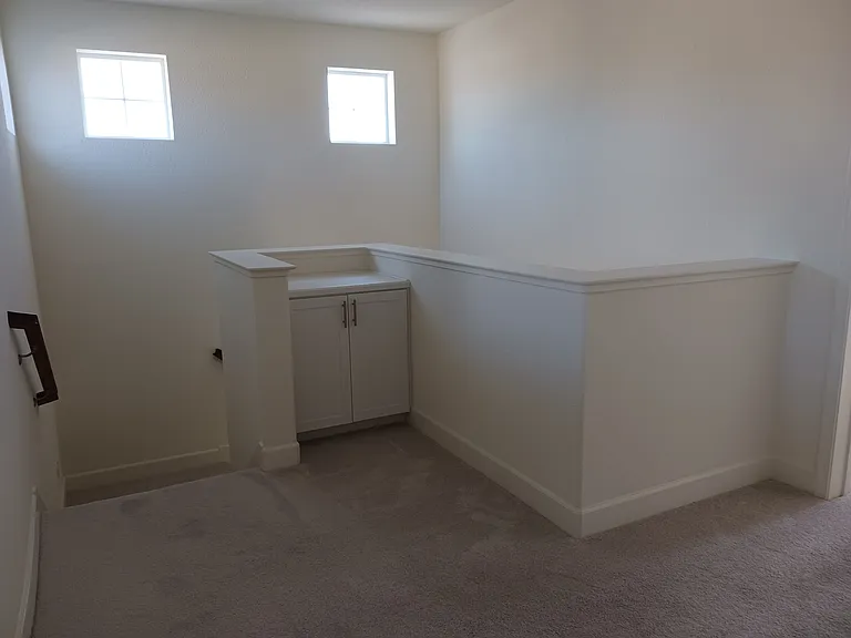 Upstairs hallway with storage