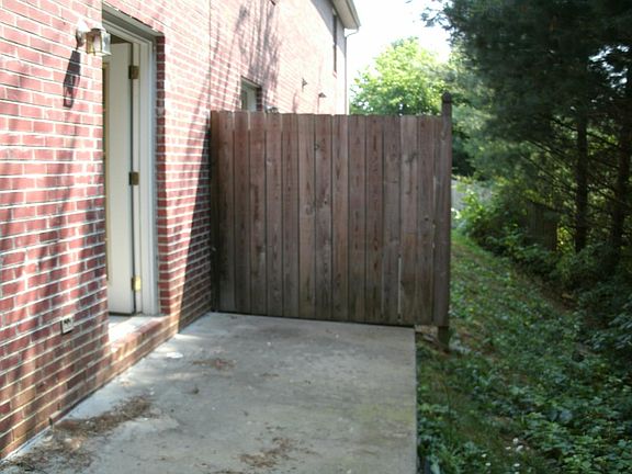 private back porch area some with grass yard