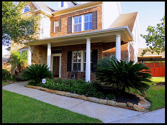 Front elevation with great front porch and  landscaping.
