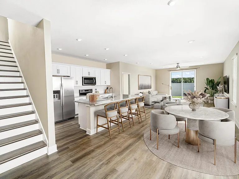 An airy, open first floor at Amavi Kissimmee offers plenty of room to gather, with easy access to nearby parks, shopping, and everyday conveniences.
