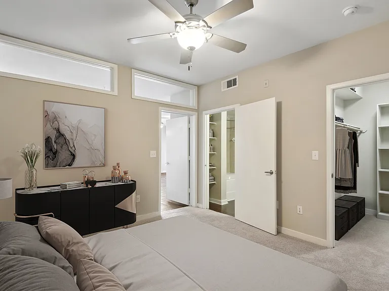 Primary bedroom with carpet and ceiling fan