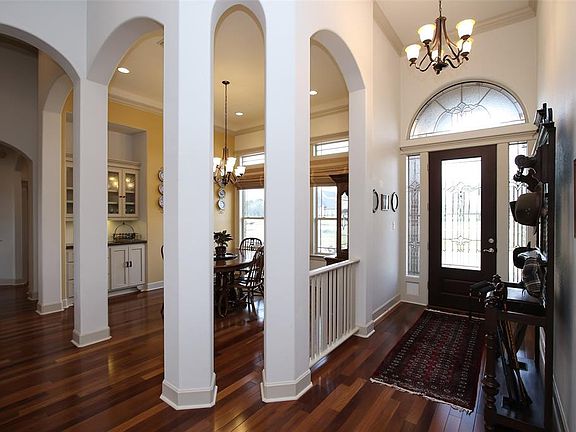 A beautiful entry with leaded glass on the front door and hardwood flooring throughout the home.