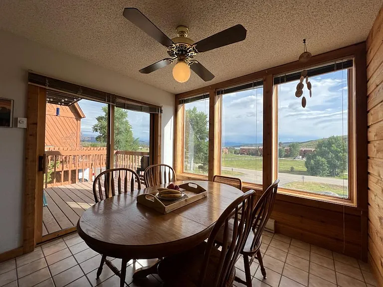 Bright and airy dining room with view of Lake Granby and the mountains.