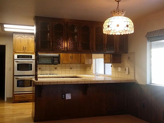 This kitchen and nook sport cabinets galore.