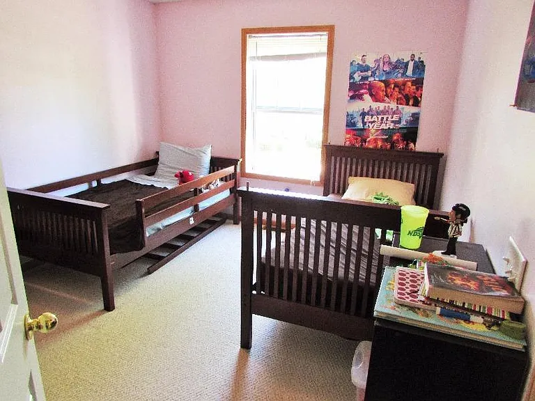 3rd bedroom with closet overlooking huge backyard