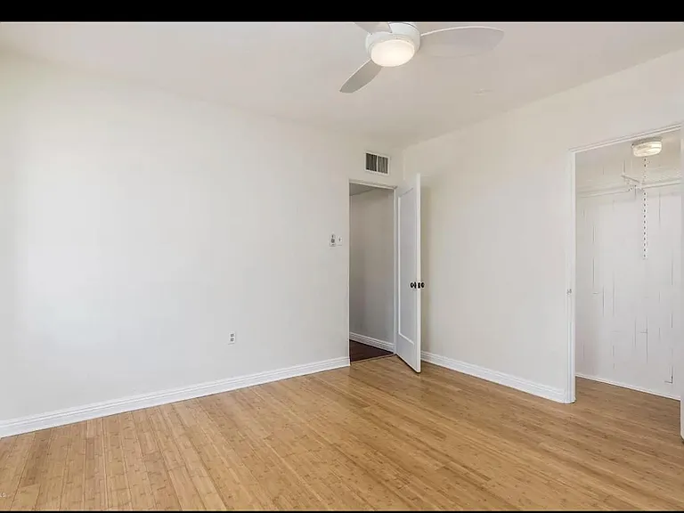 spare bedroom with bamboo wood floors