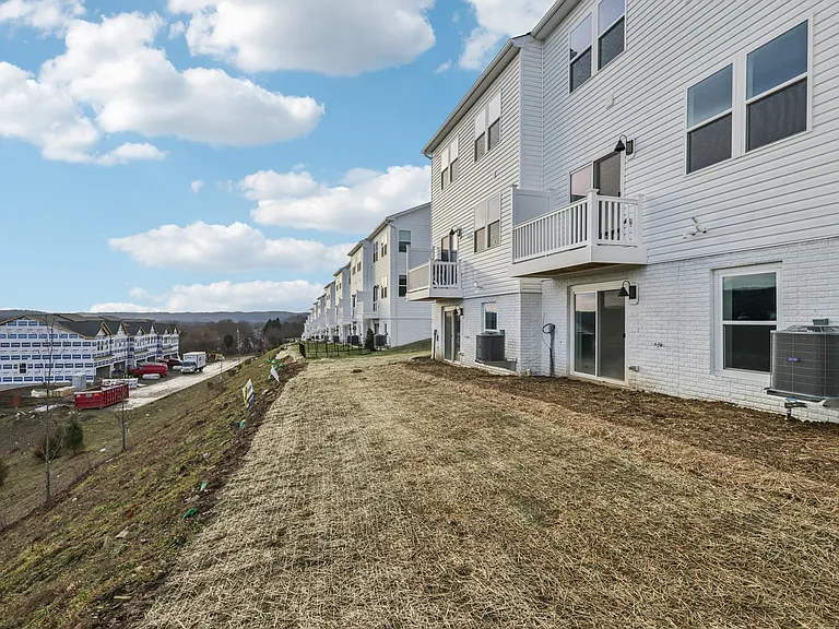 Rear view - walkout basement, first floor deck, level backyard