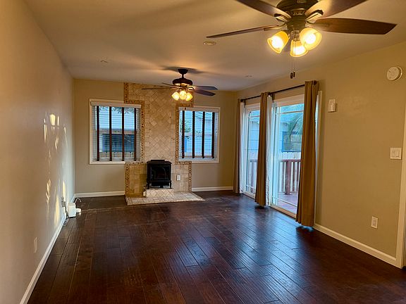 Living room from kitchen angle facing gas fireplace (recently serviced)