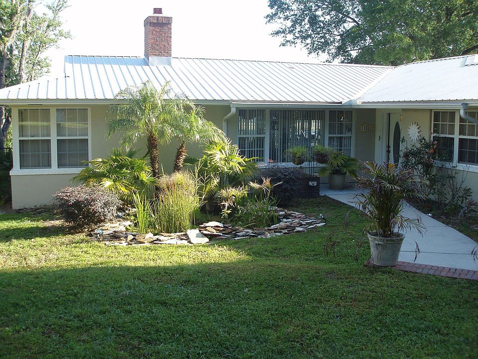 Up close view of front door area and KOI pond