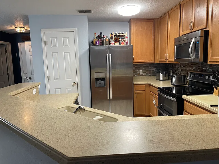 Kitchen area, with entryway visible in top left corner