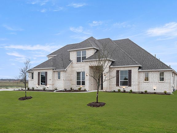 Side view of exterior of a new traditional style home by Kindred Homes