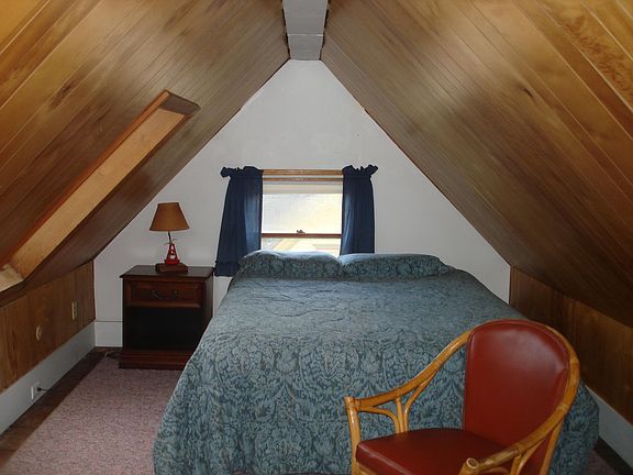 bedroom area with queen bed