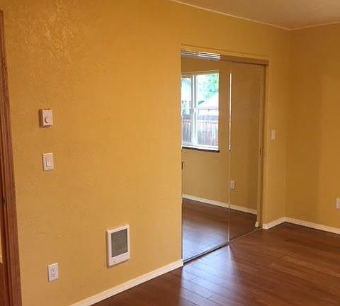 Master Bedroom with mirror doors Approximately 14' x 11'.